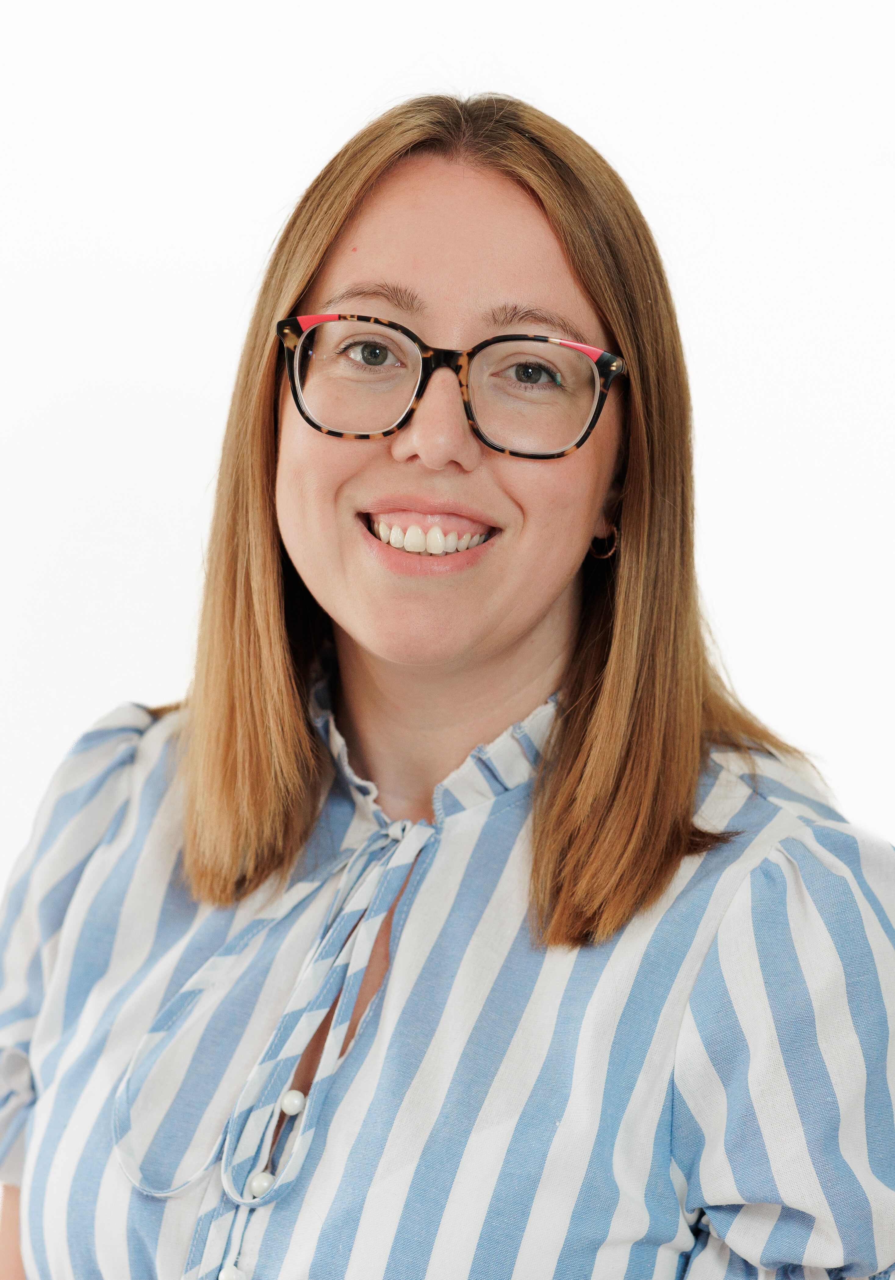 A diverse group of professionals in a modern office setting, representing the SmartAssessor team.