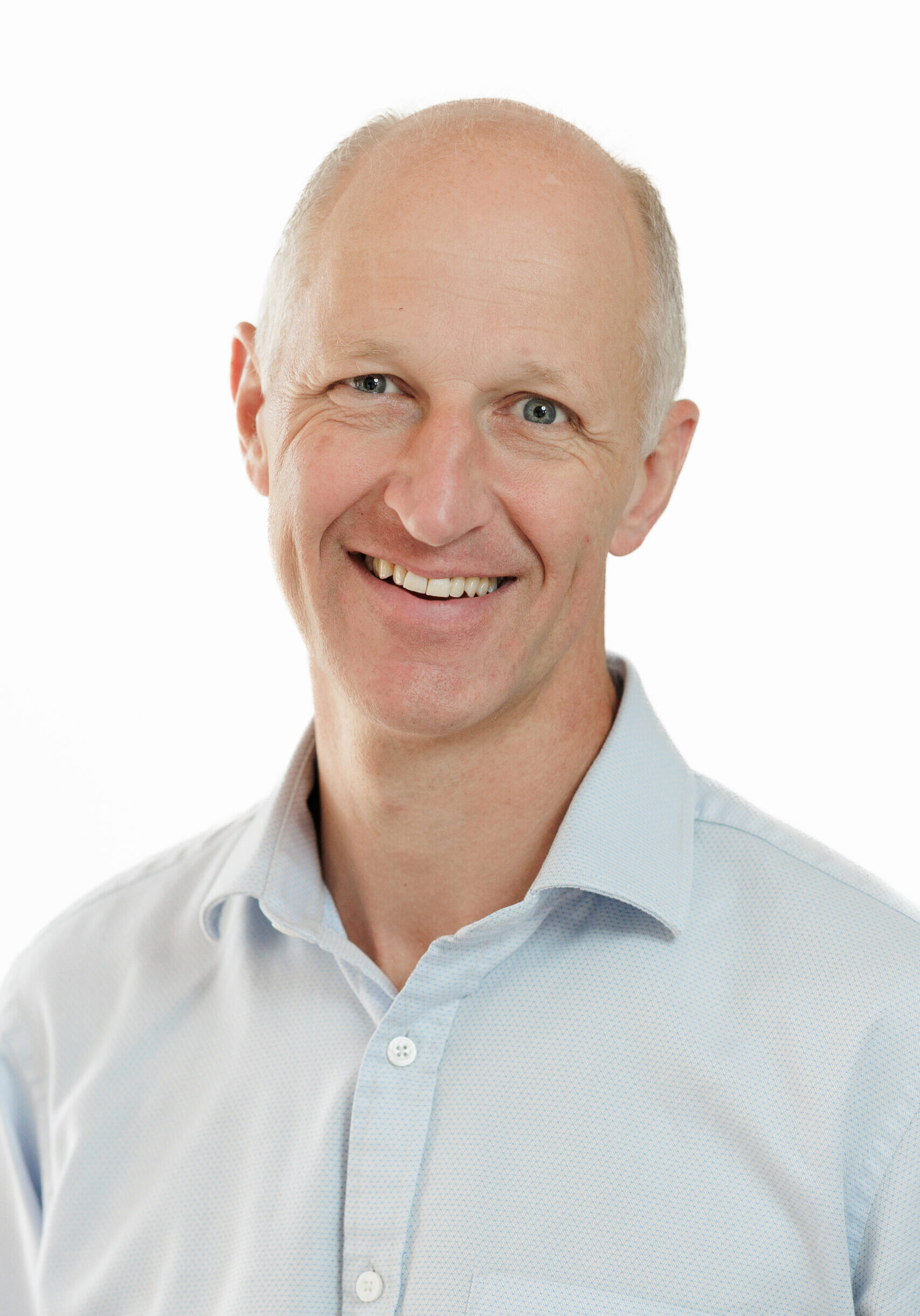 A smiling man, representing a member of the SmartAssessor team.