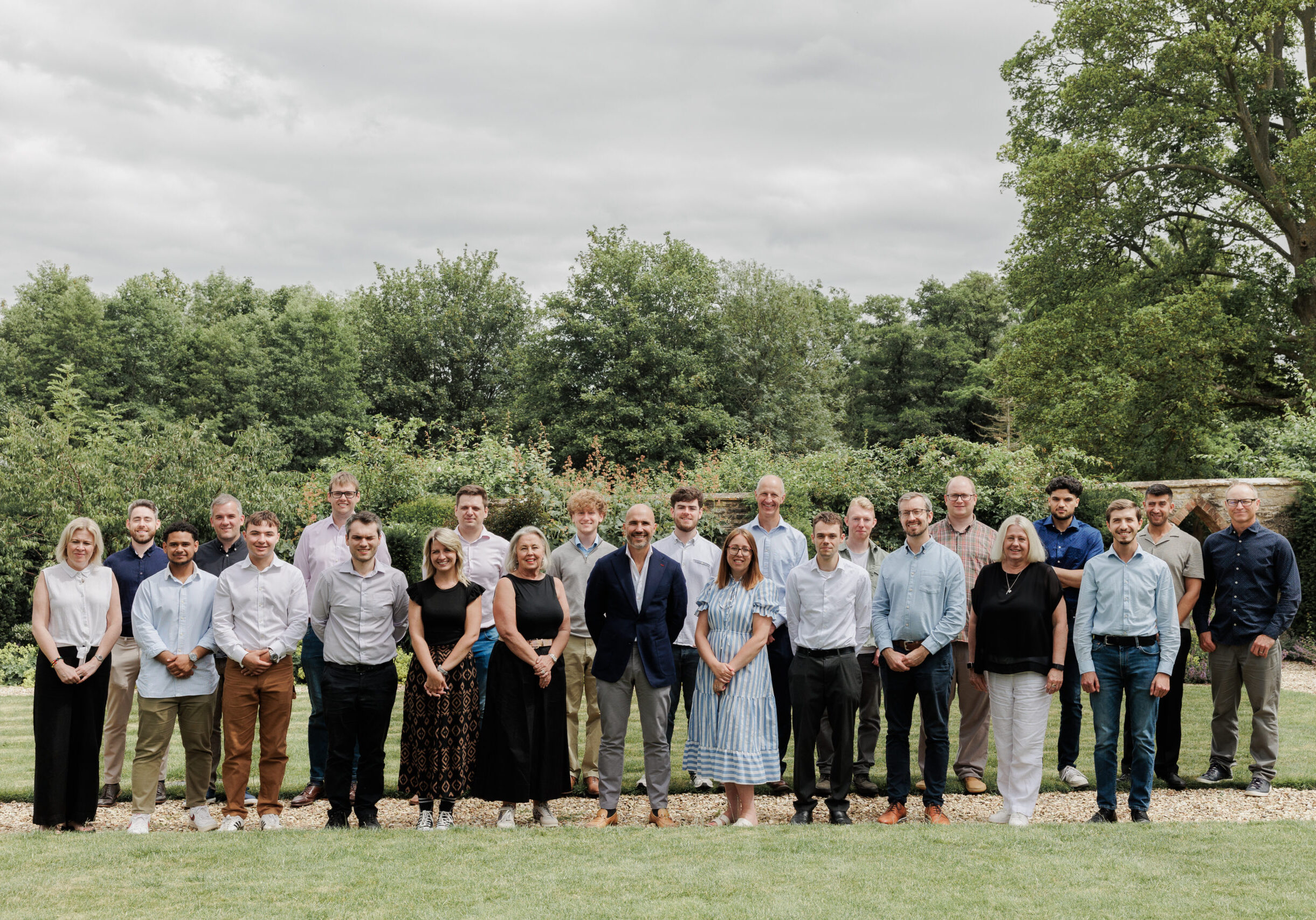 The SmartAssessor team posing for a group photo outdoors.