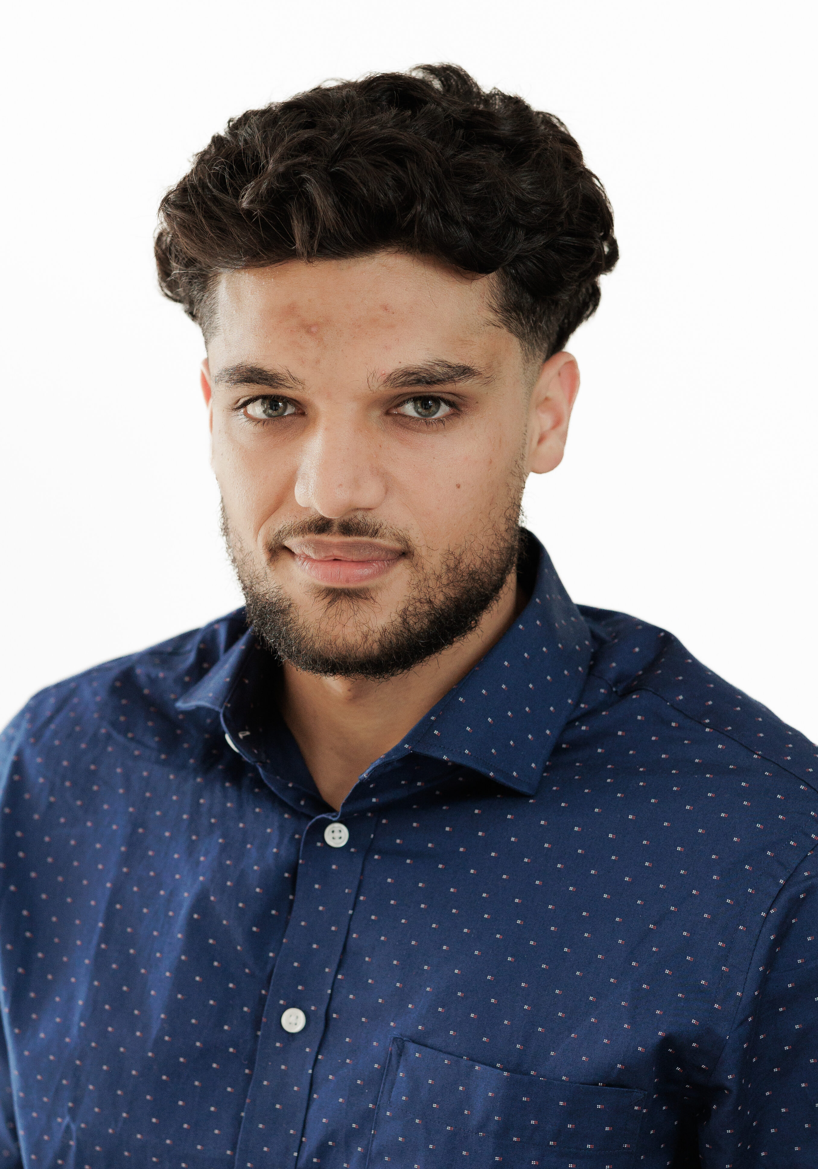 A diverse group of professionals in a modern office setting, representing the SmartAssessor team.