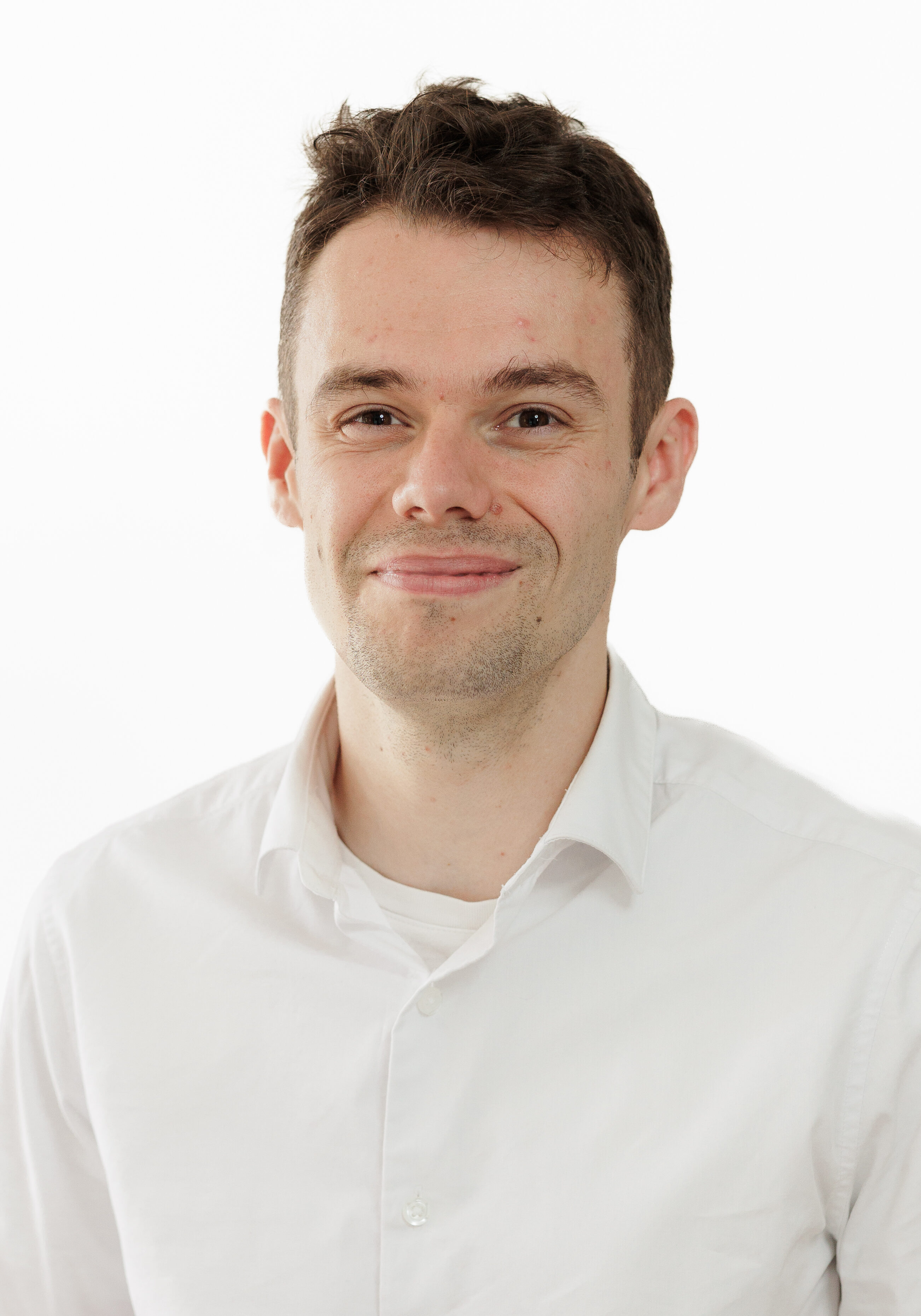 A diverse group of professionals in a modern office setting, representing the SmartAssessor team.