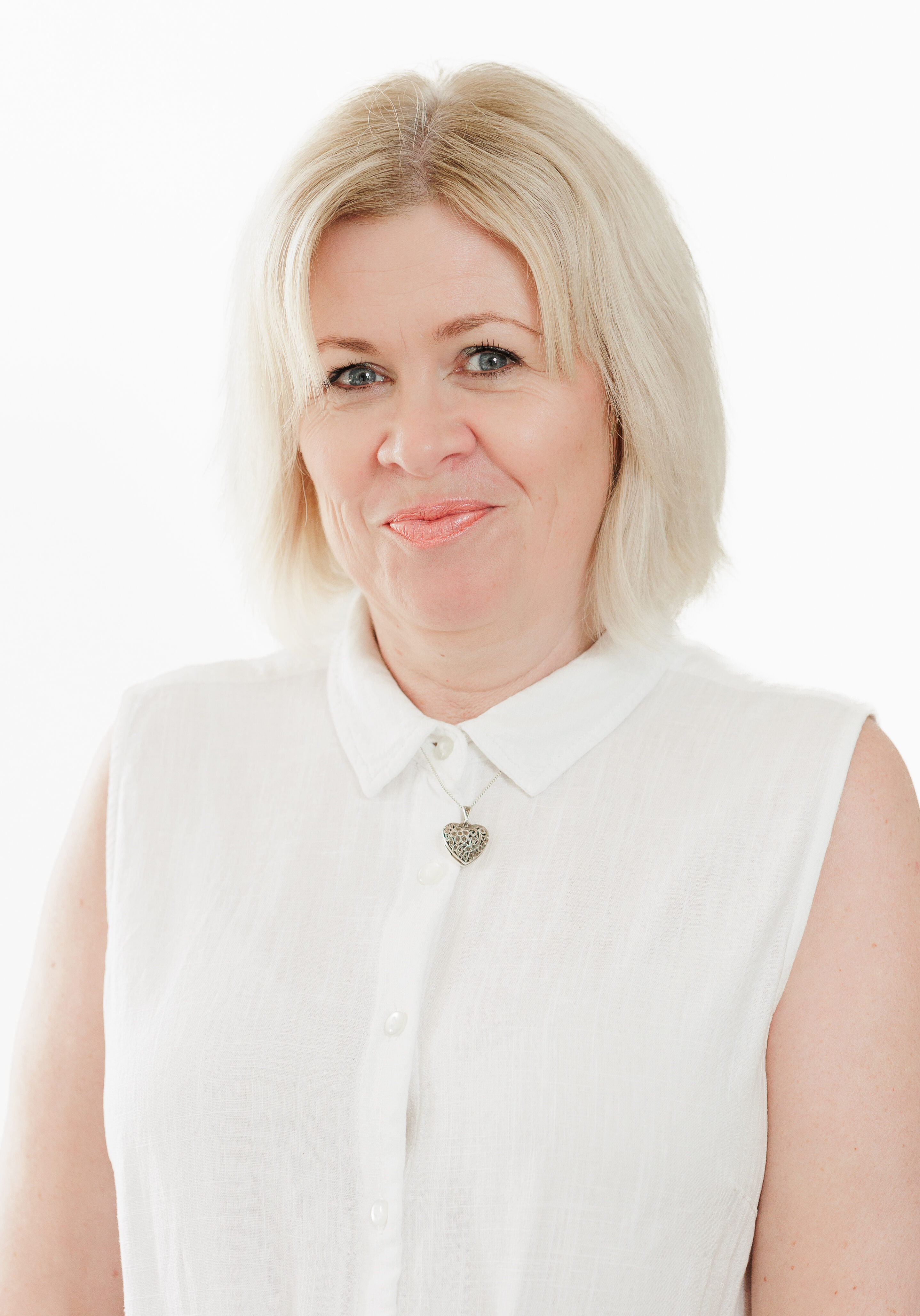 A diverse group of professionals in a modern office setting, representing the SmartAssessor team.