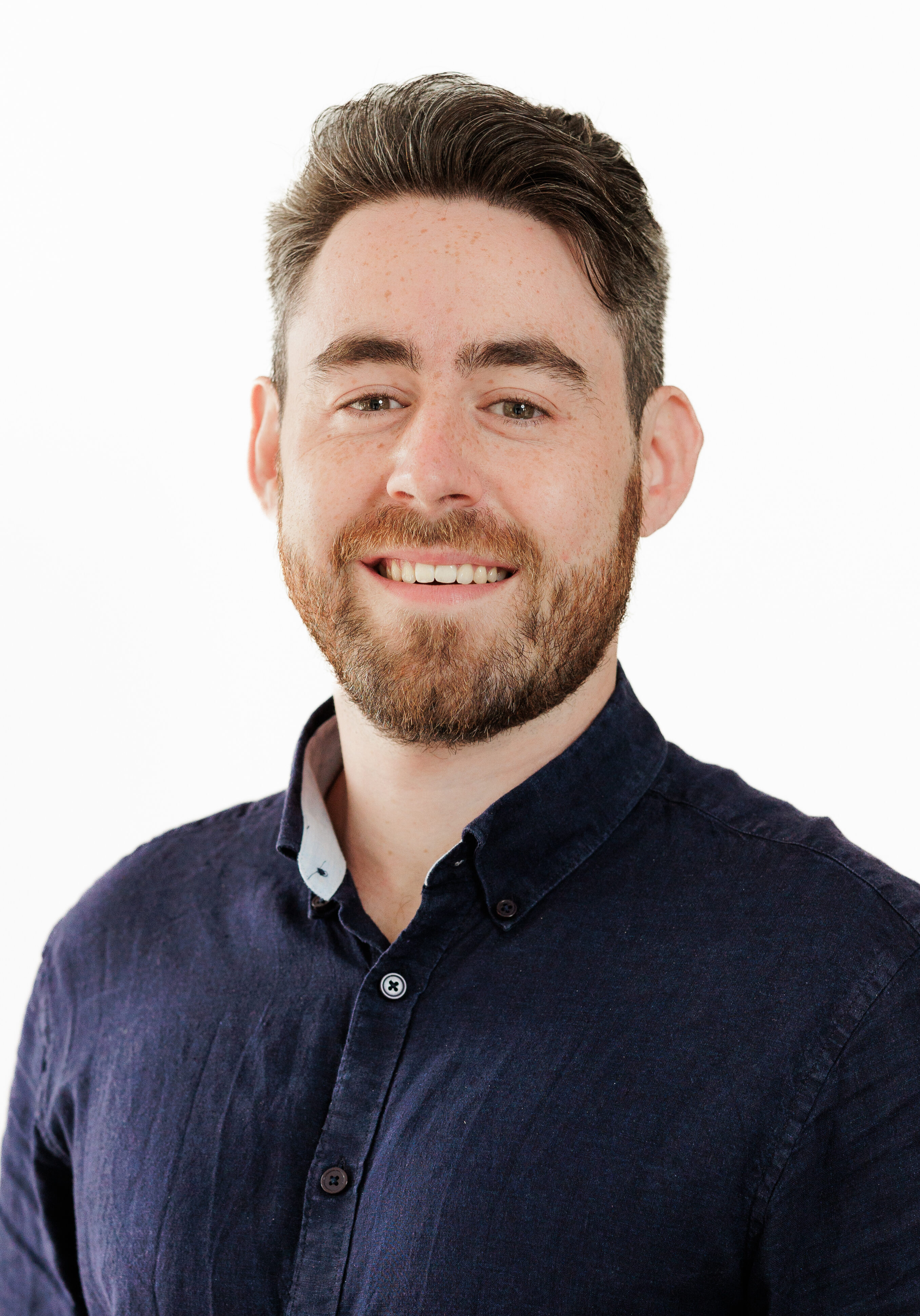 A diverse group of professionals in a modern office setting, representing the SmartAssessor team.