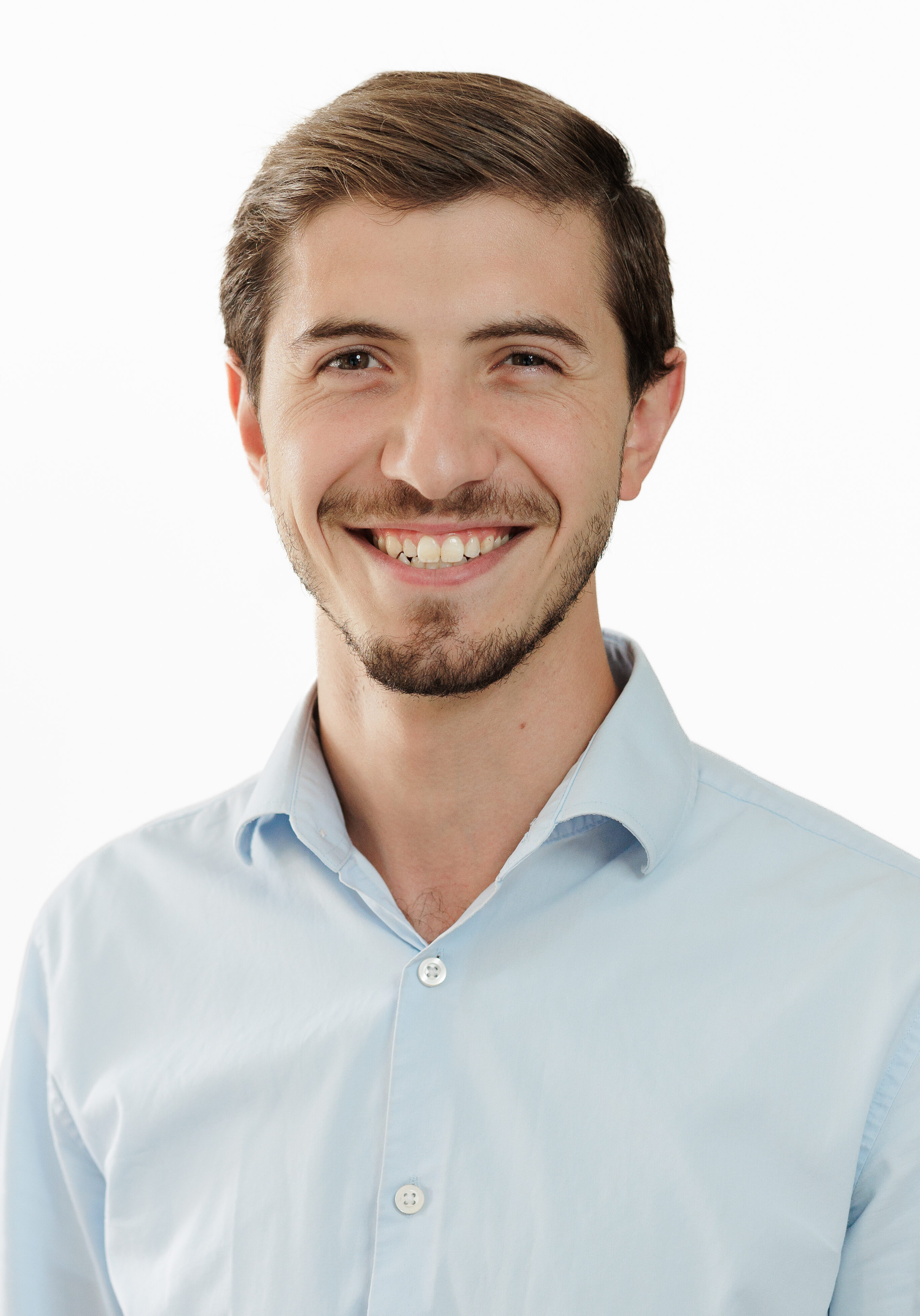 A diverse group of professionals in a modern office setting, representing the SmartAssessor team.