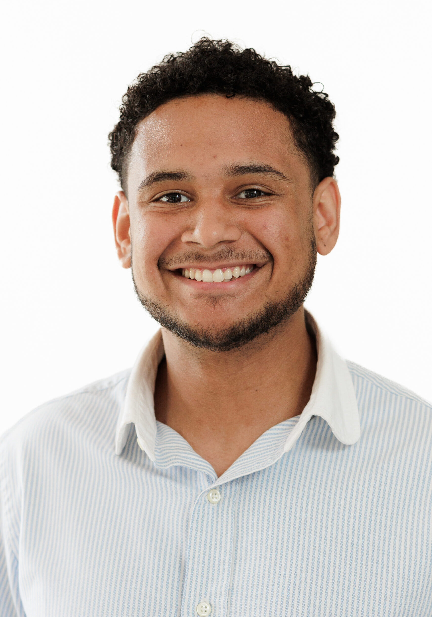 A smiling man, representing a member of the SmartAssessor team.