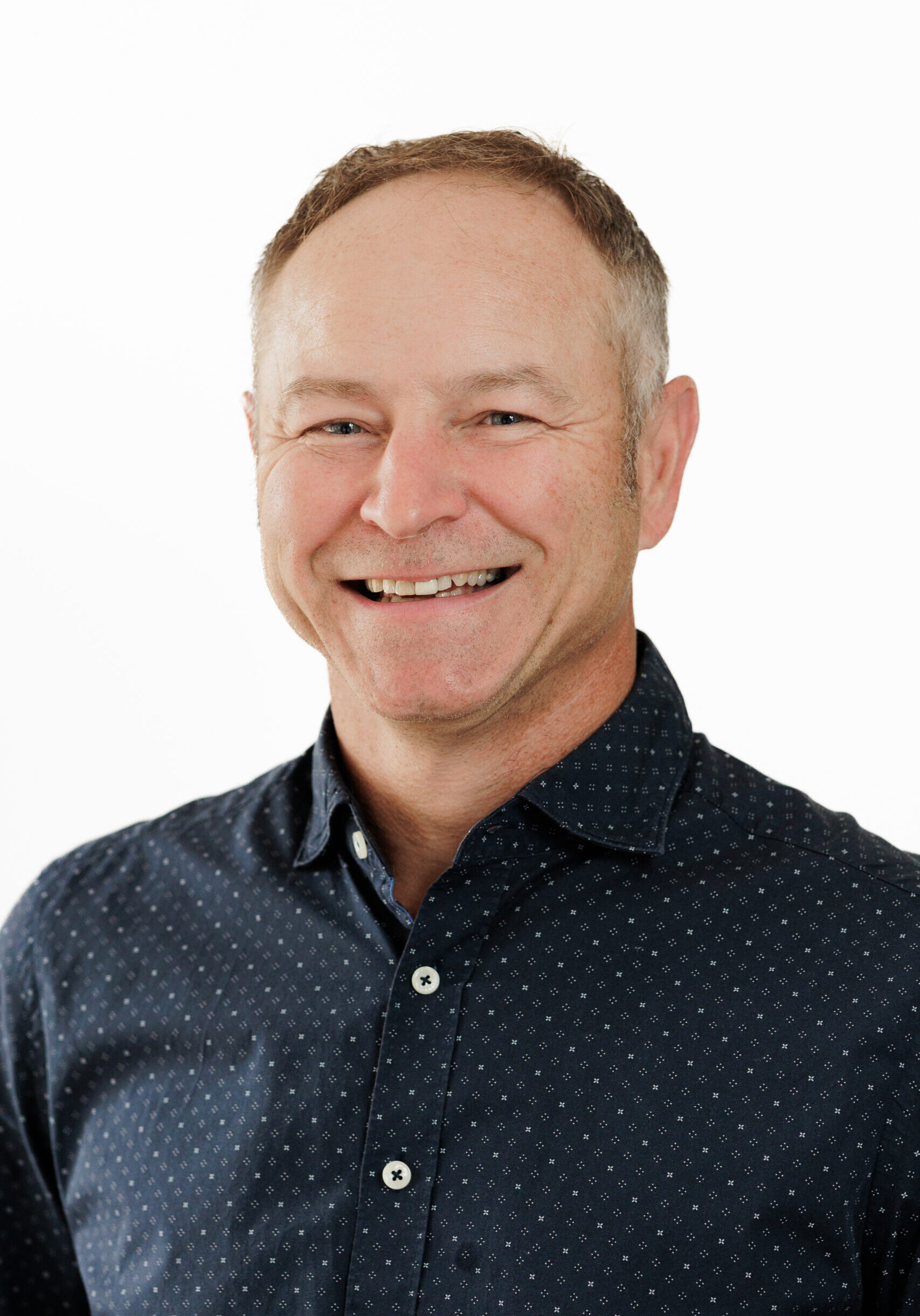 A smiling man, representing a member of the SmartAssessor team.